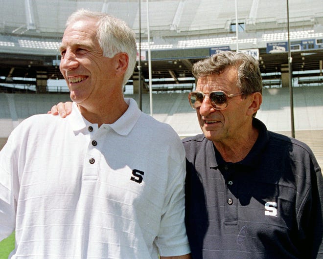 FILE - In this Aug. 6, 1999, file photo, Penn State head football coach Joe Paterno, right, poses with his defensive coordinator Jerry Sandusky during Penn State Media Day at State College, Pa. Penn State President Eric Barron is decrying new allegations in a letter Sunday, May 8, 2016, that former coach Paterno was told that Sandusky had sexually abused a child as early as 1976 and that assistant coaches witnessed the abuse of other children. (AP Photo/Paul Vathis, File)