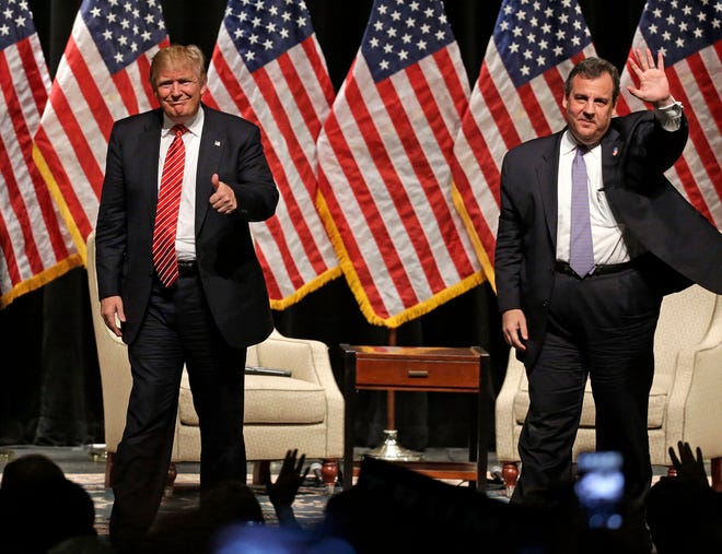 FILE - In this March 14, 2016 file photo, Republican presidential candidate Donald Trump gives a thumbs up as New Jersey Gov. Chris Christie waves to the crowd as they walk off the stage after a rally at Lenoir-Rhyne University in Hickory, N.C. Christie's decision to endorse Donald Trump back in February brought him plenty of derision at the time. But it's bringing rewards now that it's clear he bet on the winner. (AP Photo/Chuck Burton, File)
