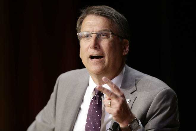 North Carolina Gov. Pat McCrory make remarks concerning House Bill 2 while speaking during a government affairs conference in Raleigh, N.C., Wednesday, May 4, 2016. A North Carolina law limiting protections to LGBT people violates federal civil rights laws and can't be enforced, the U.S. Justice Department said Wednesday, putting the state on notice that it is in danger of being sued and losing hundreds of millions of dollars in federal funding. (AP Photo/Gerry Broome)