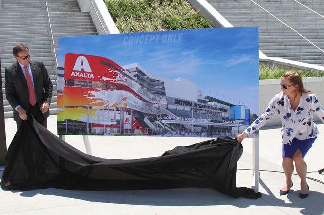 Charlie Shaver, Chairman of the Board and Chief Executive Officer of Axalta and Lesa France Kennedy, International Speedway Corperation Chief Executive Officer unvail a artist rendering of the Axalta fan injector, Monday May 9, 2016 at Daytona International Speedway..  News-Journal/David Tucker