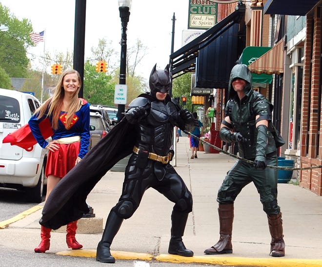 Ready to perform their superheroe duties Saturday in downtown Hillsdale were comic book characters Supergirl, Batman and the Green Arrow. NANCY HASTINGS PHOTO