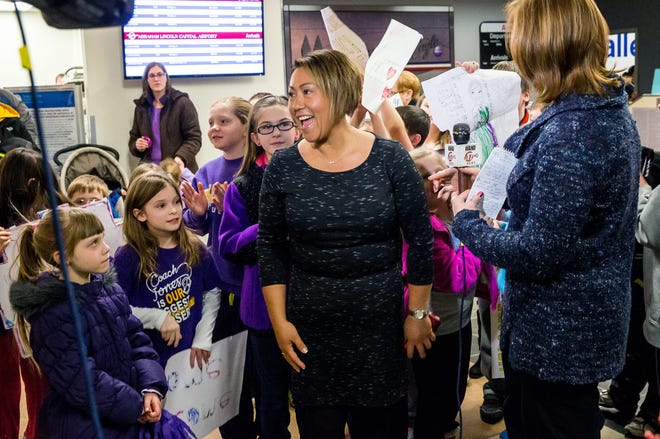 Sonya Jones, a contestant on the Biggest Loser and physical education teacher and coach at Sherman Elementary School, is surrounded by young supporters as she arrives at the Abraham Lincoln Capital Airport, Monday, Feb. 2, 2015, in Springfield. Justin L. Fowler/The State Journal-Register