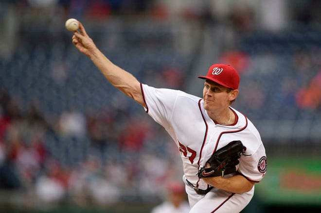 Washington Nationals pitcher Stephen Strasburg delivers a pitch during a game against the Detroit Tigers on Monday in Washington. The team announced Tuesday it had signed Strasburg to a new contract.