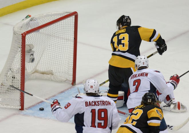 Nick Benino puts the puck in for a goal during overtime in the Penguins' 4-3 win over the Capitals in Game 6 in the Second Round of the 2016 NHL Stanley Cup Playoffs on Tuesday at Consol Energy Center in Pittsburgh.