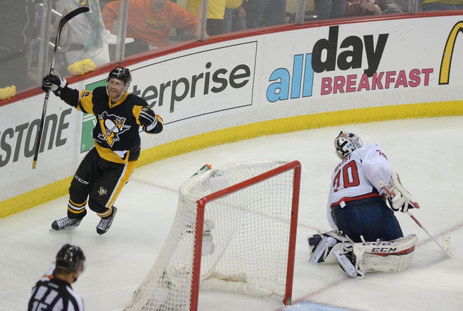 The Penguins' Patric Hornqvist celebrates after scoring a goal on Washington Capitals goalie Braden Holtby in overtime of the Penguins' 3-2 win in Game 4 of the Stanley Cup playoffs Wednesday at Consol Energy Center in Pittsburgh.