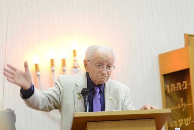 Abram Piasek gives details from his childhood years spent in a concentration camp on Sunday at ‘A Holocaust Remembrance Service’ at Kinston Unitarian Universalist Congregation on Sunday.