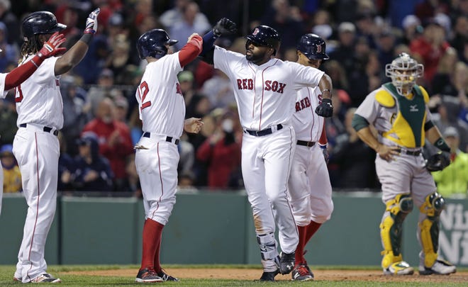 Boston's Jackie Bradley Jr., center, celebrates after his grand slam during the sixth inning on Monday night. AP Photo