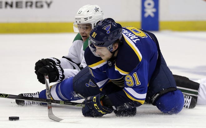 The St. Louis Blues' Vladimir Tarasenko, right, and the Stars' Mattias Janmark battle for the puck Monday during Dallas' 3-2 win in Game 6. JEFF ROBERSON/THE ASSOCIATED PRESS