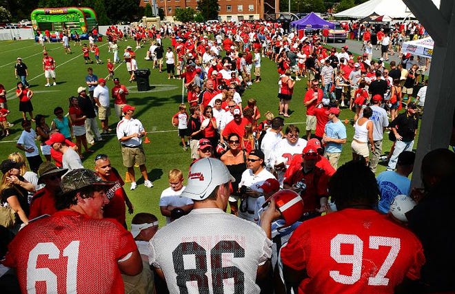 Georgia players from left Ben Jones, Tripp Chandler, and Brandon Wood sign autographs at the annual Countdown to Kickoff event in 2008 at Woodruff Plaza (Kelly Lambert/Staff)