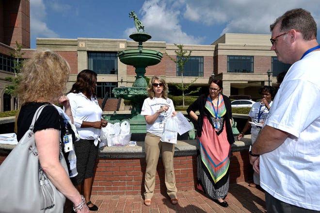 Charlie Norwood VA Medical Center VA2K Walk coordinator Sheri Loflin, middle, talks with volunteers during a pre-event in downtown Augusta Wednesday morning May 11, 2016. VA staff volunteers and community participants met near the 9th street fountain and then walked around downtown Augusta to spread the word about the charity walk and get as many people as possible to participate. The sixth annual Walk will be held on May 18th at 8:30 AM. Proceeds from the walk benefit Charlie Norwood VA Medical Center homeless veterans programs.