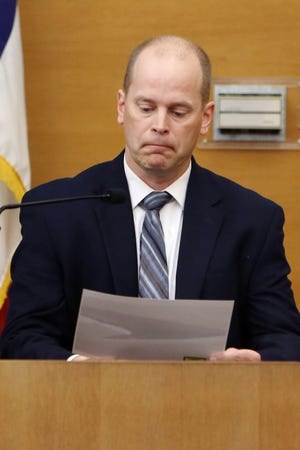 DCI case agent Matt George looks over a photograph during Randall Payne’s first-degree murder trial, Tuesday May 10, 2016 at the Des Moines County District Court in Burlington. George testified Tuesday in Payne’s first-degree murder trial he interviewed Payne at a Davenport residence. He said offered to allow Payne to take a polygraph test, but Payne declined, saying he had “talked to some lawyers who told him a polygraph test is not accurate.”