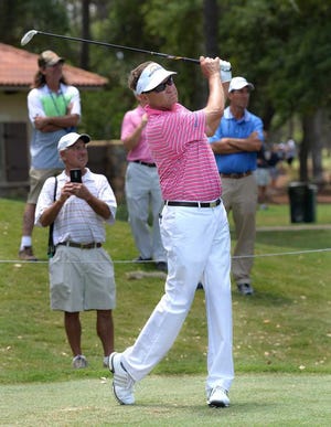 Bruce.Lipsky@jacksonville.com  Davis Love III tees off on the 12th hole during a practice round for The Players on Wednesday at the Stadium Course at TPC Sawgrass.