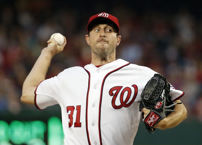 Washington Nationals starting pitcher Max Scherzer throws during the third inning of a baseball game against the Detroit Tigers at Nationals Park, Wednesday, May 11, 2016, in Washington. (AP Photo/Alex Brandon)