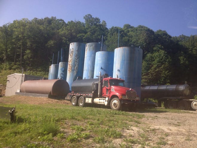 A wastewater disposal facility with storage tanks and tanker trucks in West Virginia.
