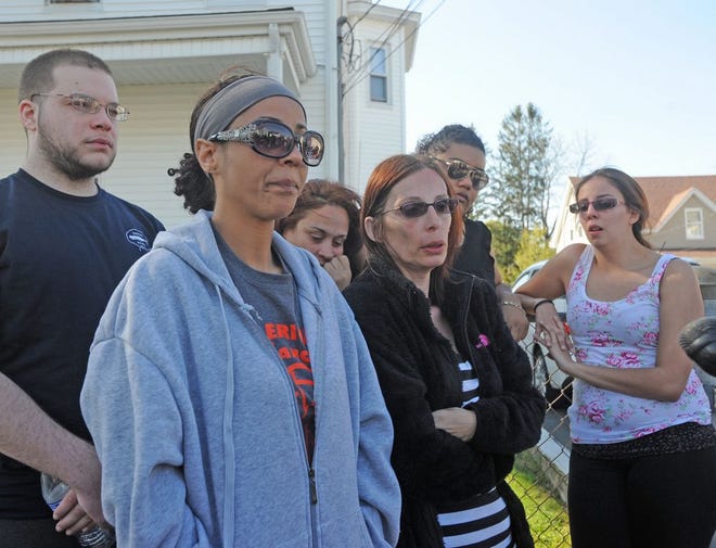 Arthur DaRosa's family at a press conference at his family home on Myrtle Street in Taunton. Family friend Erica Wrightington, left, and his Aunt Liz DaRosa, center, answer questions.
