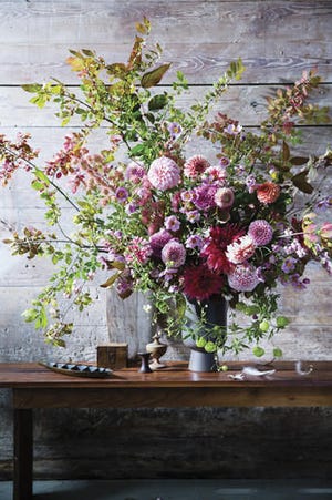 This undated photo provided by Ten Speed Press shows a floral centerpiece featured in the book "The Flower Workshop" by Ariella Chezar. (Erin Kunkel/Ten Speed Press via AP)