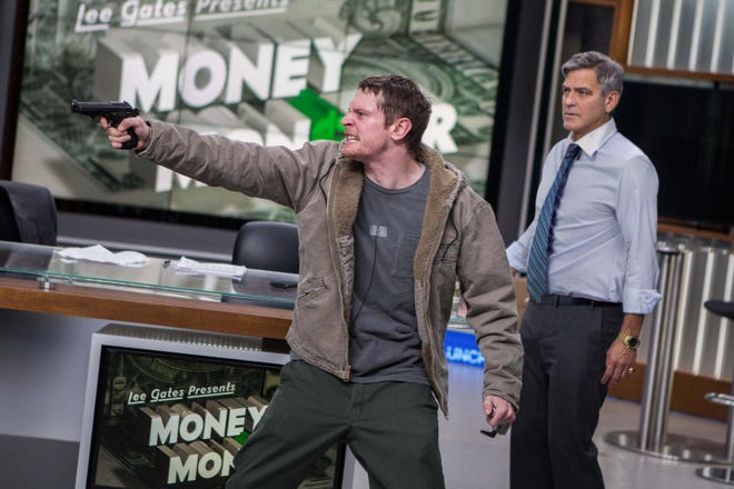 Jack O'Connell, left, plays a desperate investor and George Clooney is a TV financial-show host in "Money Monster." Atsushi Nishijima/TriStar Pictures- Sony Pictures