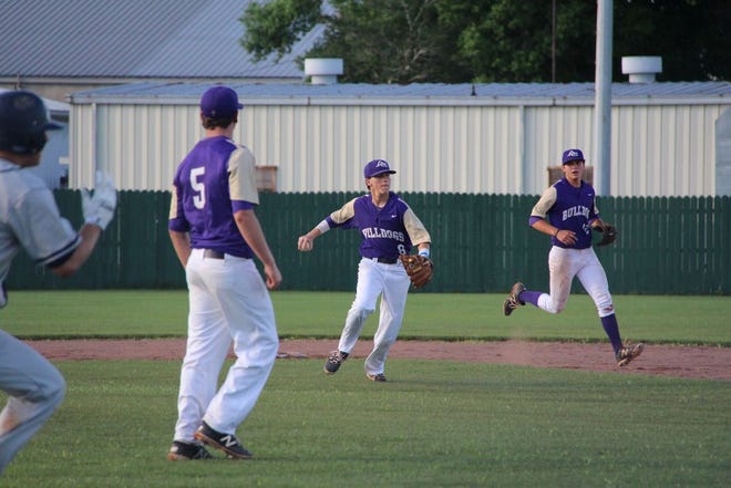 Ascension Catholic's William Dunn makes a throw to first. Photo by Kyle Riviere.