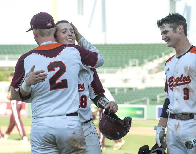Photos by Marc Beaudin For the Times-Union Christ's Church players Caleb Gay (2), Cole Berger (center) and Aaron Anderson congratulate each other after the Class 2A state championship game on Thursday in Fort Myers, despite losing to Trinity Christian Academy 12-1.