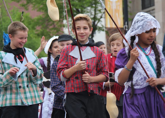 Costumed students carried a variety of props during the Kinderparade on Wednesday afternoon, May 12 — including fishing poles with wooden shoes on the end, cut-out cows, spinning windmill blades and Maypole ribbons. Caleb Whitmer/Sentinel Staff