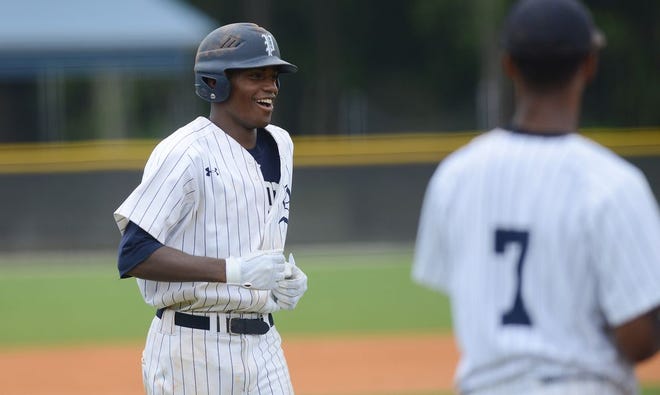 Zaccheaus Rasberry celebrates another home run against Catawba in the fifth inning Thursday at Arendell Parrott Academy.