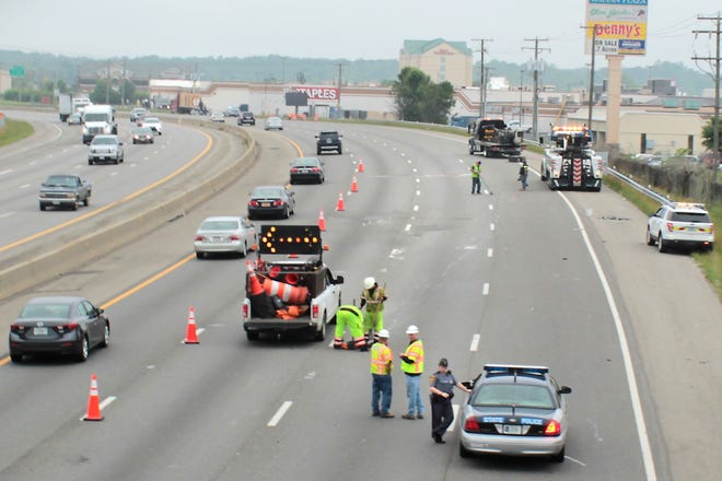 Traffic on I-95 northbound moves slowly after a tractor trailer droped some of its payload in the roadway at exit 53 in Colonial Heights on Thursday, May 12, 2016. Virginia Department of Transportation crews and Virginia State Police were on scene to clear the incident. Michael Buettner/progress-index.com