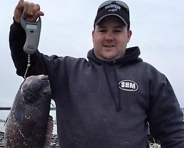 Travis Barao and his father Gil caught tautog to 9.1 pounds this weekend.