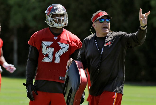 Tampa Bay Buccaneers linebacker Noah Spence (57) works with a coach during NFL football rookie minicamp Friday, May 6, 2016, in Tampa.