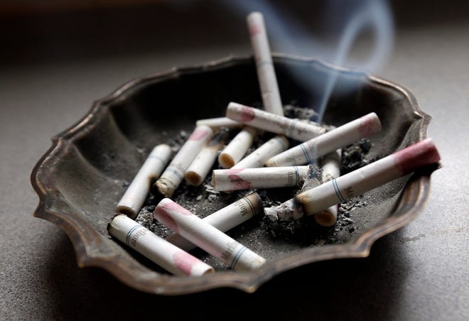 In this Saturday, March 2, 2013, photo, a cigarette burns in an ashtray at a home in Hayneville, Ala. (AP Photo/Dave Martin)