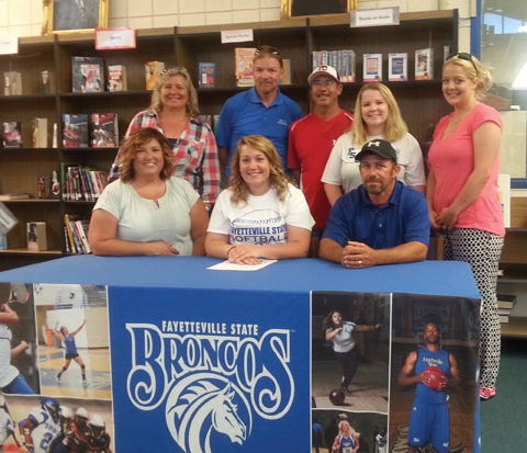 West Craven High senior Courtney Pierre, front row center, committed to play softball at Fayetteville State. She was joined on Thursday by her parents Eric and Nicole Pierre, and softball coaches Sheila Holloway, Scott Smith, Todd Pulley and Ashley Brown.