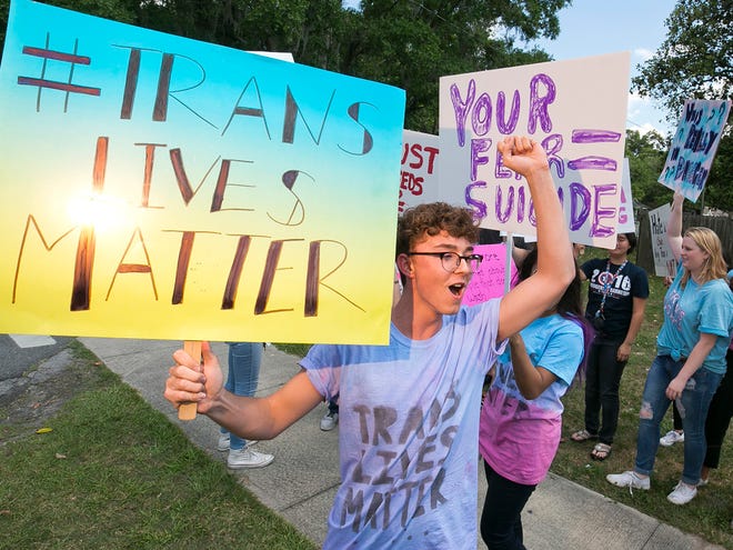 Nich Rardin, an 11th-grader at Vanguard High School, center, coordinated a Transgender Lives Matter protest on April 29 outside the school over a transgender bathroom ban imposed by the Marion County School Board.