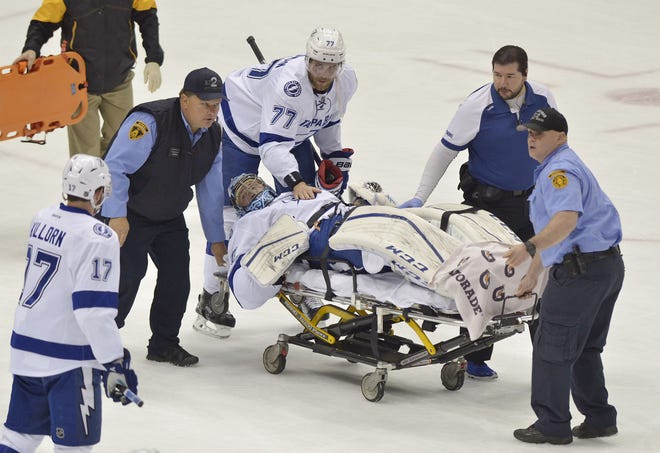 Tampa Bay Lightning goalie Ben Bishop is wheeled off the ice on a stretcher after getting injured during the first period of Game 1 of the Eastern Conference final on Friday at Consol Energy Center in Pittsburgh.