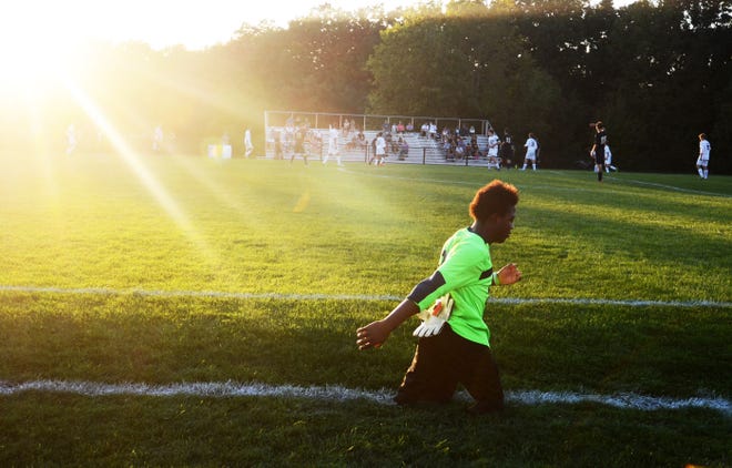Emmanuel Hilton was born without lower legs. As the backup goalie on the Blackhawk High School junior varsity soccer team, he heads to the net to play the last 10 minutes of the Cougars' game against Hopewell High School on Sept. 17.