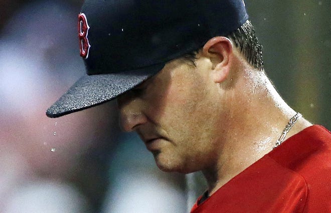 For Red Sox starting pitcher Steven Wright, Friday night's game at Fenway Park was a walk in the rain. Michael Dwyer/Associated Press