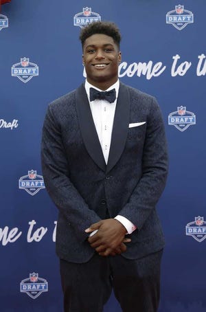 UCLA's Myles Jack poses for photos upon arriving for the first round of the 2016 NFL football draft at the Auditorium Theater of Roosevelt University, Thursday, April 28, 2016, in Chicago. (AP Photo/Nam Y. Huh)