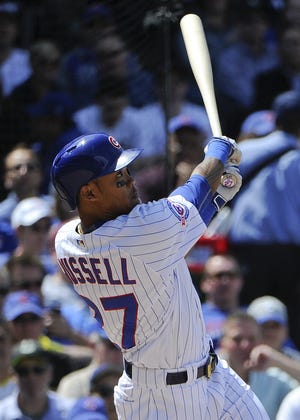 Chicago Cubs' Addison Russell hits a three-run homer in the fourth inning of a baseball game against the Pittsburgh Pirates on Friday, May 13, 2016, in Chicago. (AP Photo/Matt Marton)