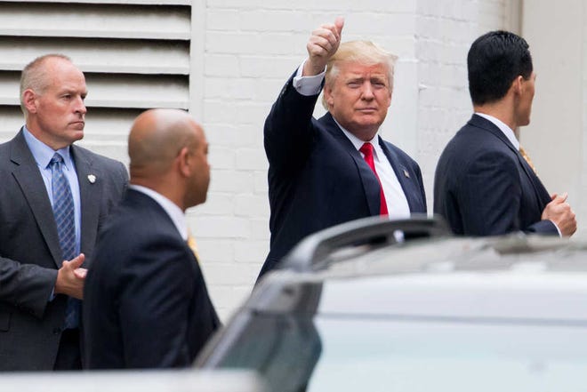Republican presidential candidate Donald Trump waves as he arrives for a meeting with House Speaker Paul Ryan of Wis., at the Republican National Committee Headquarters on Capitol Hill in Washington, Thursday, May 12, 2016. Trump and Ryan are sitting down face-to-face for the first time, a week after Ryan stunned Republicans by refusing to back the mercurial billionaire for president. (AP Photo/Andrew Harnik)