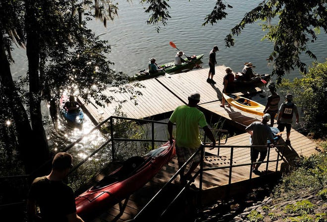 Paddlers load their boats into the water at the Savannah Rapids Pavillion during the Savannah Riverkeeper's 10th Annual Paddlefest.
