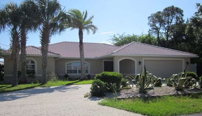 This house on Clinton Court North in Palm Coast has four bedrooms and three baths in 2,381 square feet of living space. Built in 2000 on a saltwater canal, it also has a screened pool and spa, dock and boat lift. It sold recently for $355,000.