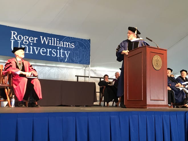 WaterFire Providence creator Barnaby Evans delivers the commencement address to Roger Williams University graduates on Saturday as RWU President Donald Farish looks on at left. Courtesy of Roger Williams University