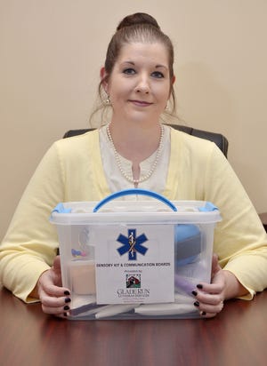 Kimberly Stanford of Vanport Township holds a sensory kit she created to help first responders interact with autistic patients.