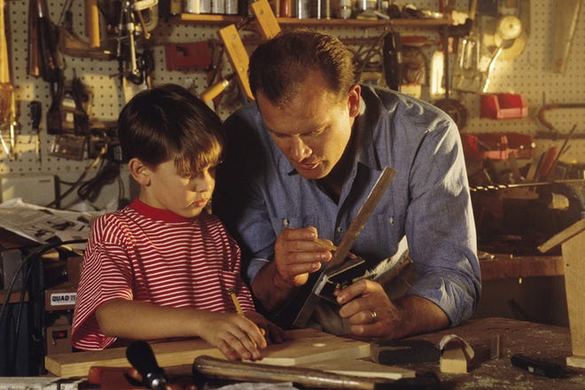 A parent and child's time at a workbench can help foster life lessons in addition to enable the completion of projects. [Comstock/Thinkstock]