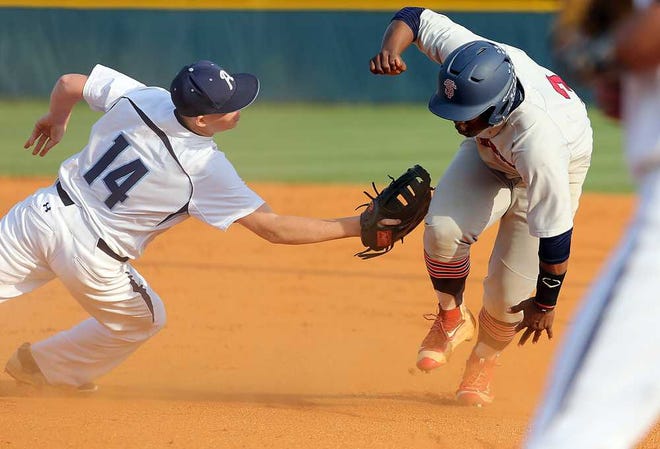 Aynor's Hayden Franklin (right) makes the tag on Strom Thurmond's Rod Dobbs during Game 1 of the Class AA state finals. The Blue Jackets took the opener Monday.