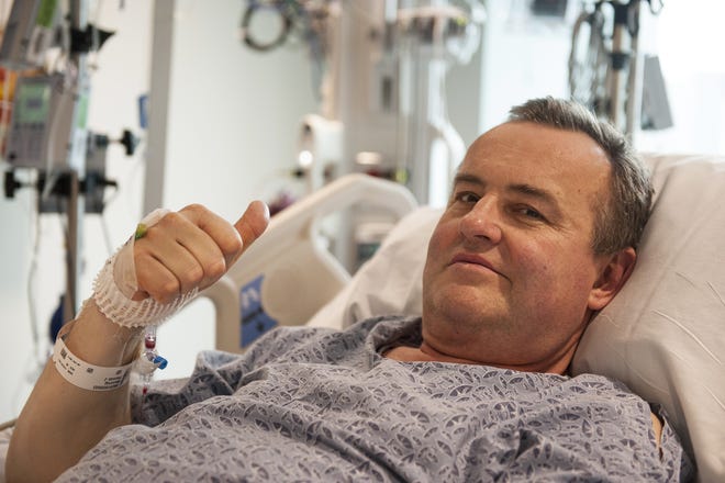 In this May 13, 2016, photo provided by Massachusetts General Hospital, Thomas Manning gives a thumbs up after being asked how he was feeling following the first penis transplant in the United States, in Boston. The organ was transplanted from a deceased donor. (Sam Riley/Mass General Hospital via AP)