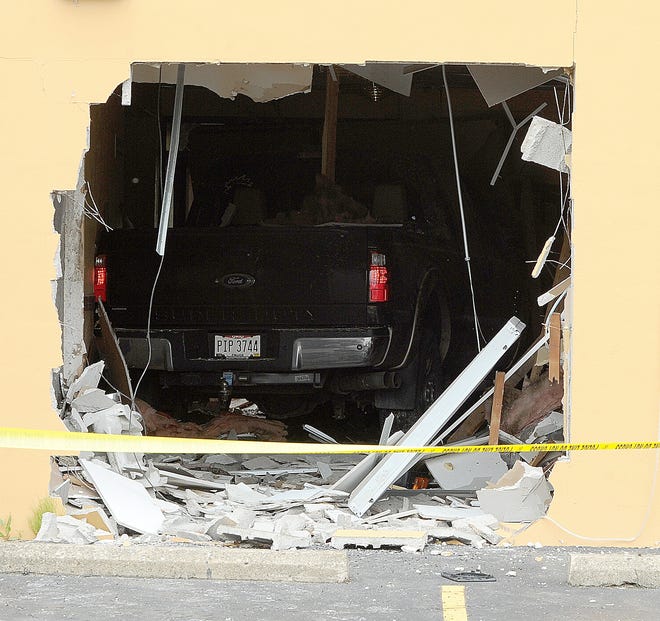 A pick-up truck drove into the side of the Bombay Sitar restaurant in Jackson Township. (CantonRep.com / Ray Stewart)