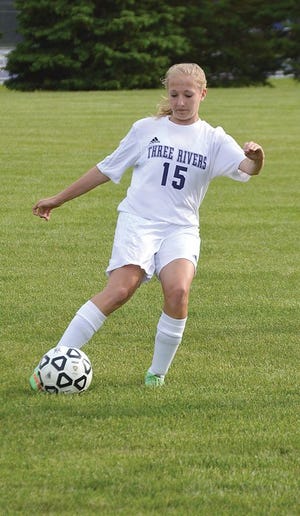 Three Rivers’ Kaitlin Ritchie passes the ball up the field Monday night.