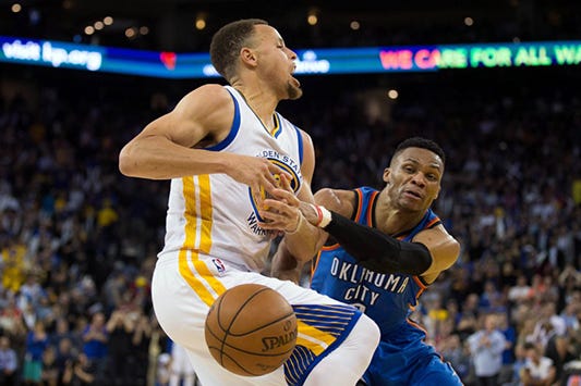 Oklahoma City Thunder guard Russell Westbrook (0) reaches to knock away the ball against Golden State Warriors guard Stephen Curry (30) during the fourth quarter at Oracle Arena in Oakland, Calif., on March 3, 2016. Kelley L Cox-USA TODAY Sports