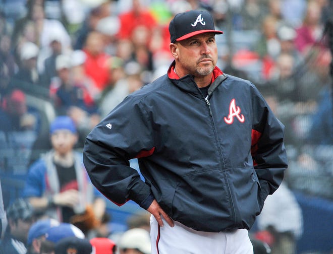 FILe - In this Oct. 4, 2015, file photo, Atlanta Braves manager Fredi Gonzalez (33) waits for a review of a call during the fourth inning of the second baseball game of a doubleheader against the St. Louis Cardinals, in Atlanta. The Atlanta Braves have fired manager Fredi Gonzalez, who couldn't survive the worst record in the majors. Braves general manager John Coppolella confirmed the firing of Gonzalez, in his sixth season, Tuesday, May 17, 2016. (AP Photo/John Amis, File)