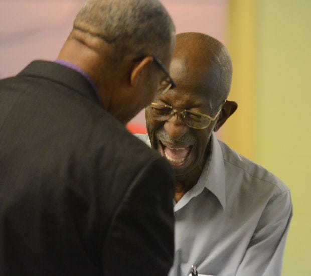 Retired pastor Calvin Brown of Beaver Falls enjoys his 90th birthday party at the Tabernacle Baptist Church in Beaver Falls on July 19, 2014.
