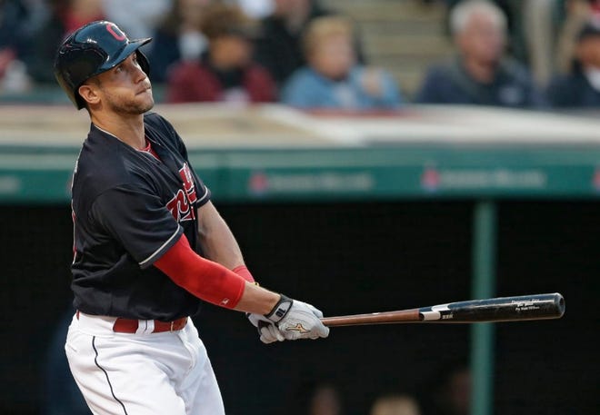 The Indians' Yan Gomes watches his three-run home run off Reds reliever Layne Somsen in the sixth inning.